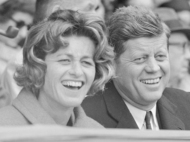 FILE - In this April 10, 1961, file photo, President John F. Kennedy and his sister, Jean Kennedy Smith, watch an opening day baseball game at Griffith Stadium in Washington. Jean Kennedy Smith, the youngest sister and last surviving sibling of President John F. Kennedy, died at 92, her daughter confirmed to the New York Times. Smith died Wednesday, June 17, 2020, at her Manhattan home, her daughter Kym told the Times. (AP Photo/File)