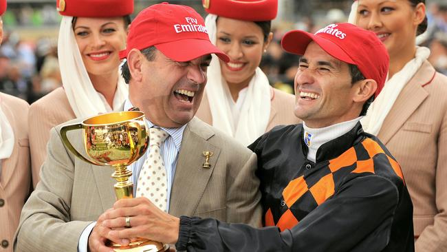 Kavanagh and jockey Corey Brown celebrate their 2009 Melbourne Cup triumph.