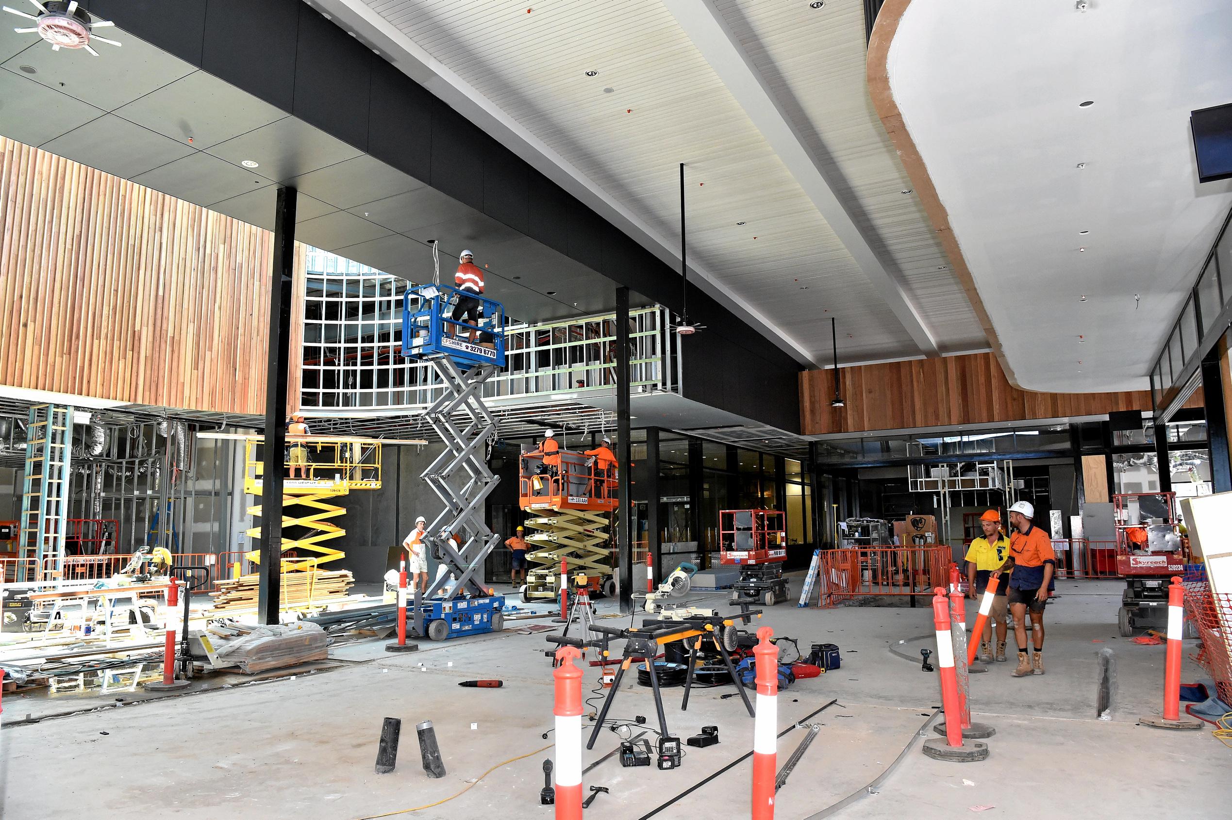 Full steam ahead for the opening of the Stockland Birtinya Shopping Centre. Constuction workers put the final pieces together for the grand opening in a couple of weeks. Picture: Warren Lynam