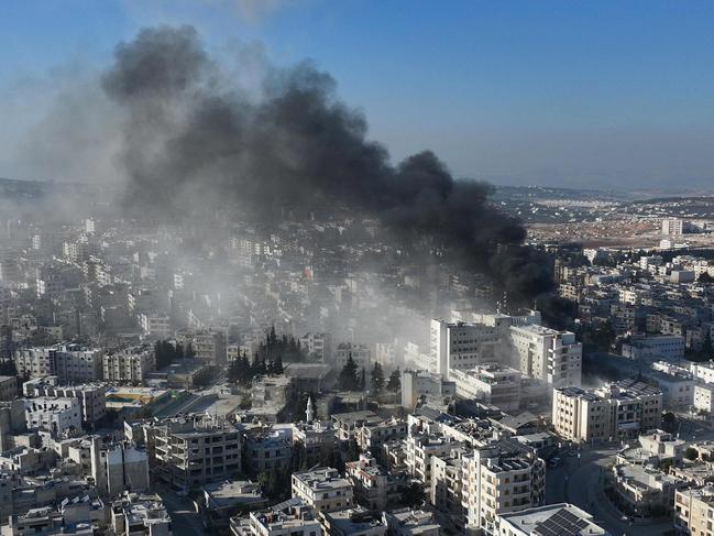 Smoke rising from the site of an air strike that targeted Syria's rebel-held northern city of Idlib. Picture: AFP