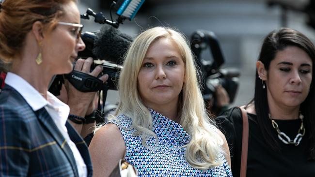 Virginia Giuffre, an alleged victim of Jeffrey Epstein, centre, exits from federal court in New York, in August. Picture: Jeenah Moon/Bloomberg