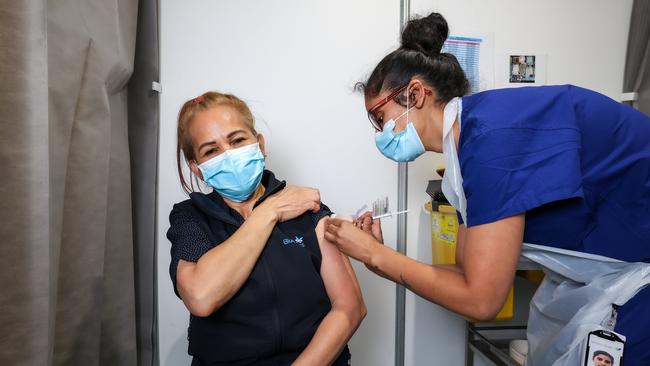 BlueCross Aged Care worker Isabelita Tassone receives the AstraZeneca vaccine at Sunshine Hospital. Picture: Ian Currie