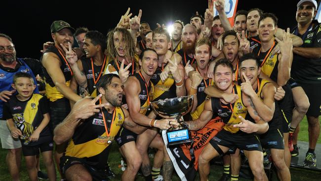 The Nightcliff Tigers celebrate their first back-to-back Premier League flags. Picture: GLENN CAMPBELL