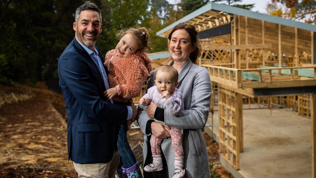 Nathan and Heike Godfrey with kids Hazel, 4, and Eugenie, 7 months, at the site of their new home. Picture: Tom Huntley