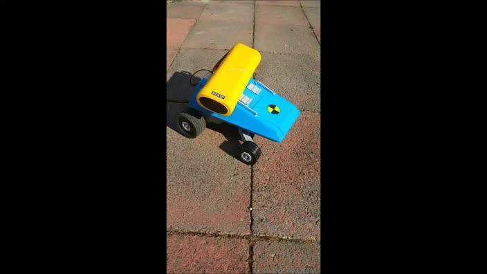 Oskar Leja uses the remote-controlled car he created