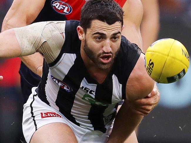 AFL Round 12. Melbourne vs. Collingwood at the MCG. Collingwood's Alex Fasolo chases the loose ball  . Pic: Michael Klein