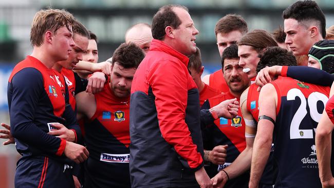 North Hobart coach Richard Robinson fires up his troops at quarter time of the clash against Lauderdale. Picture: NIKKI DAVIS-JONES