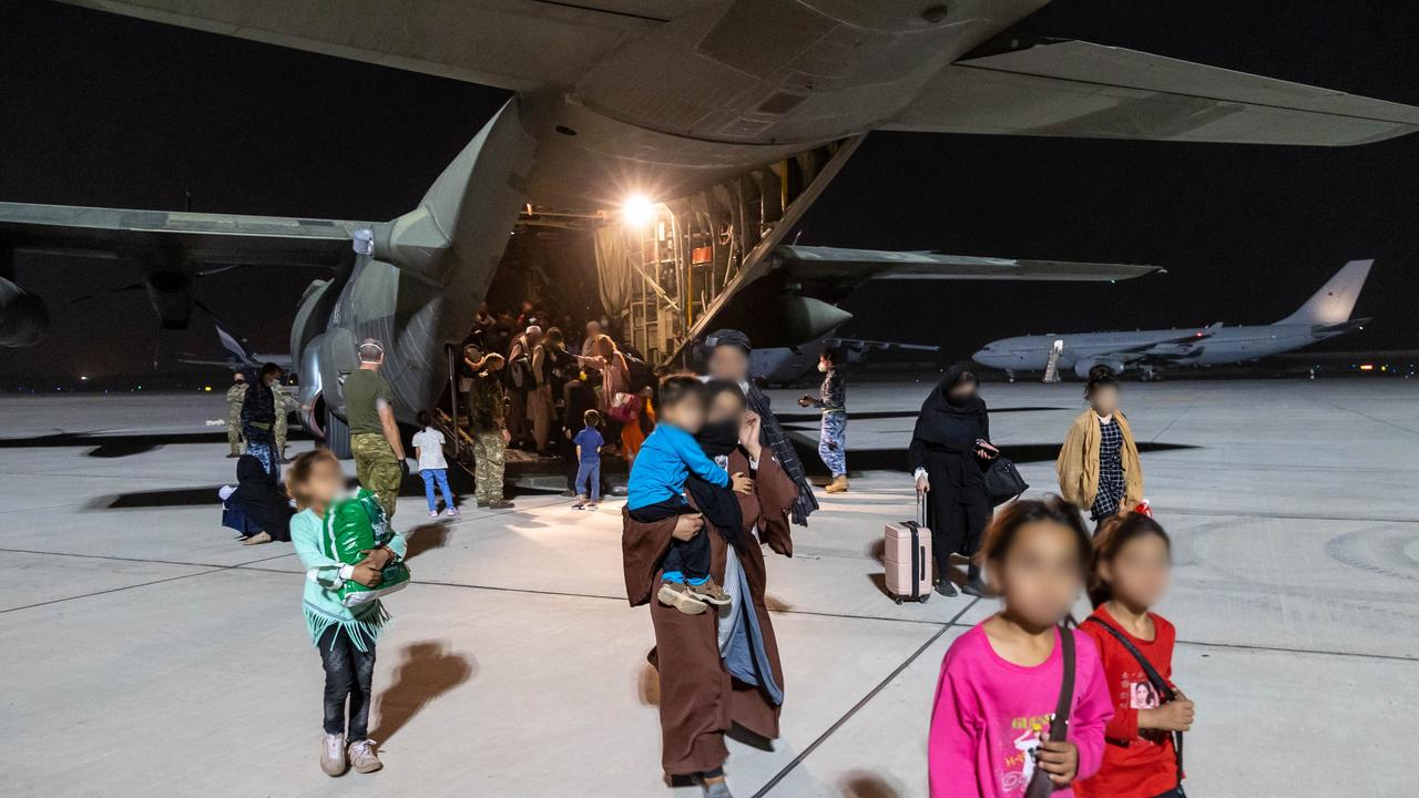 Evacuees from Afghanistan disembark an Australian rescue flight.