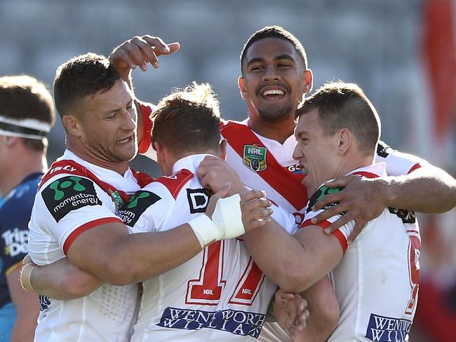 Tariq Sims, Nene MacDonald and Cameron McInnes with Kurt Mann after he scored a try.