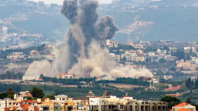 This picture taken from the southern city of Tyre shows smoke billowing from the site of an Israeli airstrike that targeted the southern Lebanese village of Rmadiyeh, on October 7, 2024. The Israeli army said on October 7 that it had deployed another division to participate in operations in Lebanon -- making it the third troop grouping at division strength to be used in the ground fight against Hezbollah. (Photo by KAWNAT HAJU / AFP)