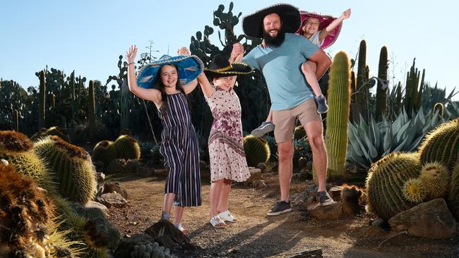 Strathmerton locals Adam Graham with Lilly 11, Lara and Abbie, both 8, at Cactus Country. Picture: Simon Dallinger