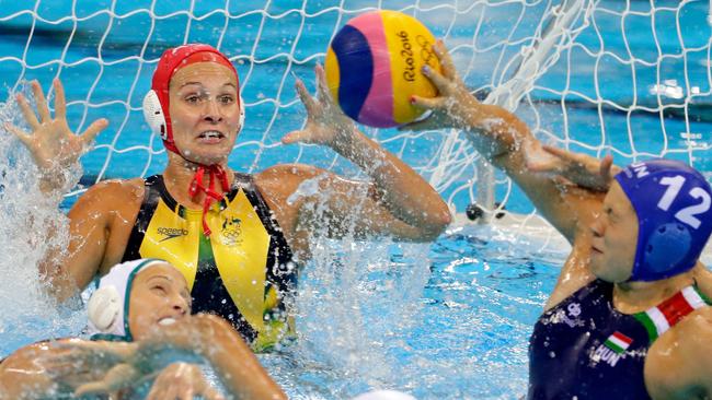 Aussie Stingers goalkeeper Lea Yanitsas defends as Krisztina Garda of Hungary takes a shot on goal during their Women's Water Polo quarterfinal match at the Rio Olympics. Picture: Jamie Squire/Getty Images.