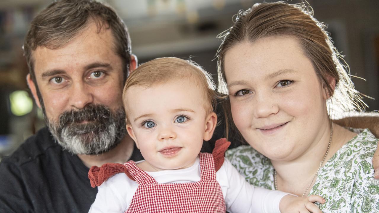 14 month old Olivia Luck with parents Nick Luck and Caity Jones. Thursday, March 17, 2022. Picture: Nev Madsen.