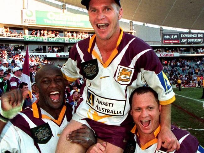 Player Wendell Sailor celebrating with Allan Langer and Kevin Walters after the 1998 grand final.