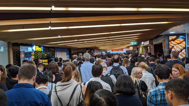 Passengers attempt to get into North Sydney station. Picture: Twitter/@katofarquharson