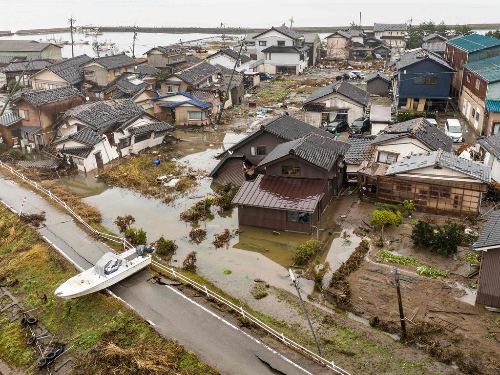 This aerial image shows a ship washed ashore next to a badly damaged area in the city of Suzu, Ishikawa prefecture on January 3. Picture: AFP