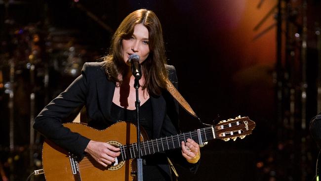 French First Lady Carla Bruni-Sarkozy performs at the 'Mandela Day' Concert to celebrate former South African president Mandela's 91st birthday at Radio City Music Hall in New York, 2009.