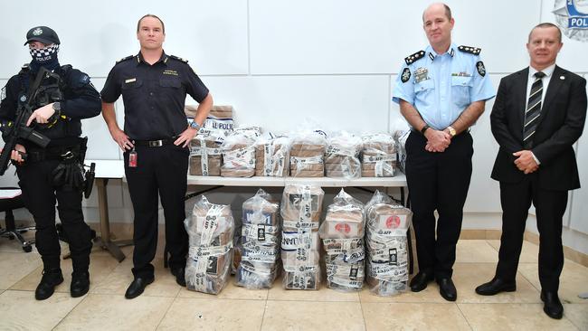 Australian Border Force Acting Assistant Commissioner James Copeman (second from left), Australian Federal Police Commander Stephen Jay and Queensland Police Service Detective Acting Chief Superintendent Craig Morrow with the alleged haul. Picture: John Gass/NCA NewsWire