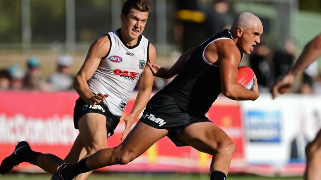 Sam Powell-Pepper sprints past Jack Trengrove in Port Adelaide's intra-club match.