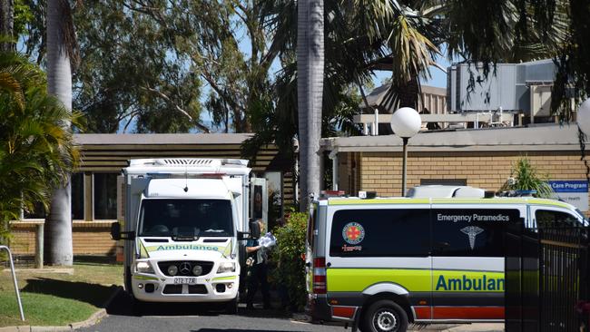 Ambulances queue outside of North Rockhampton Nursing Centre for the transfer of some patients and residents.