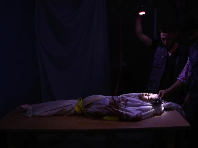 A picture taken on October 28, 2016 shows the body of a Syrian child wrapped in shrouds at a make-shift morgue following government shelling on the rebel-held town of Douma, on the eastern outskirts of Damascus. Picture: AFP PHOTO / Abd Doumany