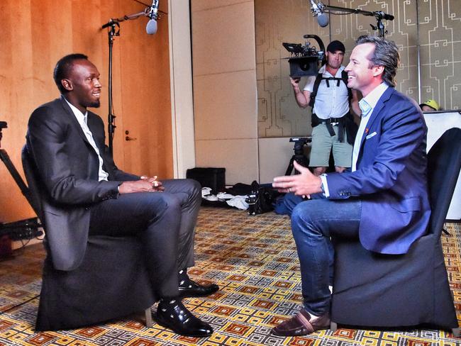Bolt takes part in yet another TV interview with a smile etched on his face.