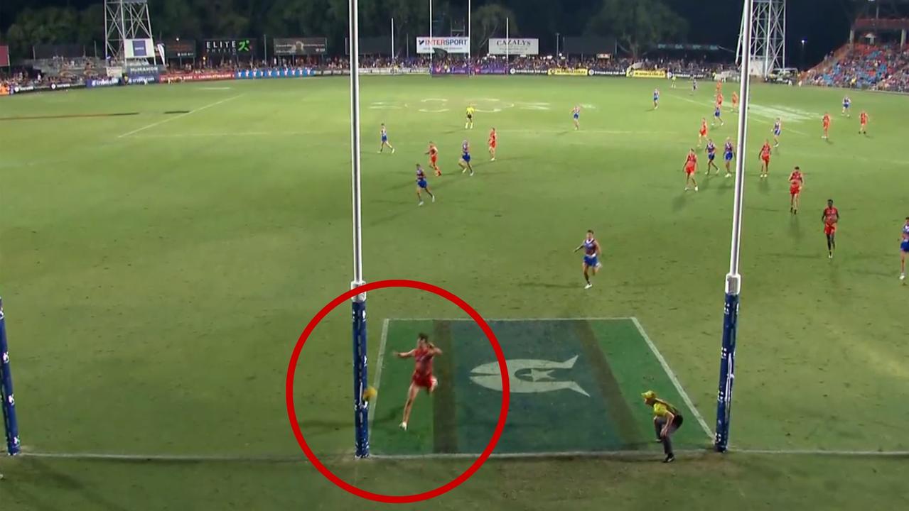 Umpires review a goal decision during the Suns-Bulldogs fixture at TIO Stadium.