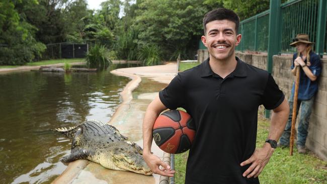 Freddy Webb shows off his basketball skills with monster croc, Speckles, at Crocodylus Park. Picture: Sam Lowe