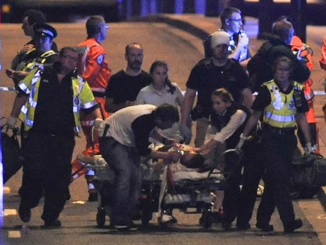 Police and members of the emergency services attend to victims of a terror attack on London Bridge. Picture: AFP