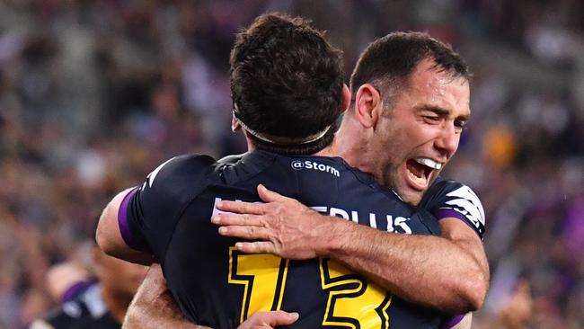 Dale Finucane and Cameron Smith of the Storm celebrate after Finucane scores a try during the NRL grand final between the Melbourne Storm and the North Queensland Cowboys at ANZ Stadium in Sydney, Sunday, October 1, 2017. (AAP Image/Mick Tsikas) NO ARCHIVING, EDITORIAL USE ONLY