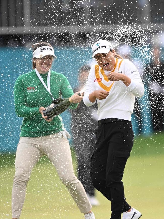 Hannah Green (left) sprays Minjee Lee with champagne as she celebrates her victory at the end of the BMW Ladies Championship in October, 2023. Picture: AFP