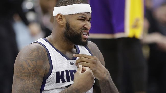 The Sacramento Kings' DeMarcus Cousins finishes off a dunk in the first  quarter against the San Antonio Spurs at Sleep Train Arena in Sacramento,  Calif., on Friday, March 21, 2014. (Photo by