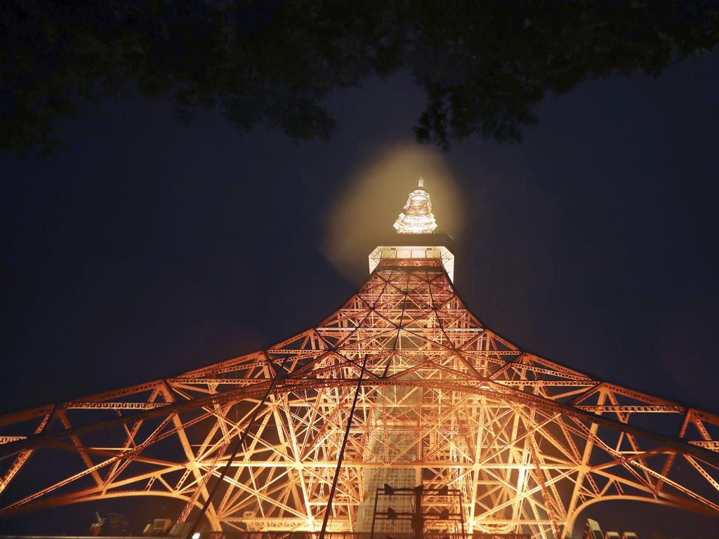 Tokyo Tower is lit in the pouring rain. Picture: AP