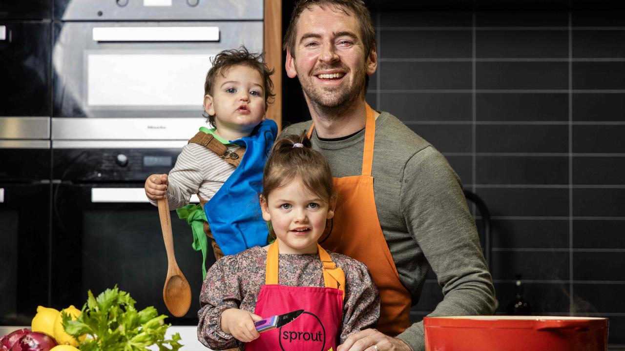 Chef and Sprout cooking school owner Callum Hann tries gets daughter Elle, 3, and son Henry, 1, helping in the kitchen. Photo: Kelly Barnes