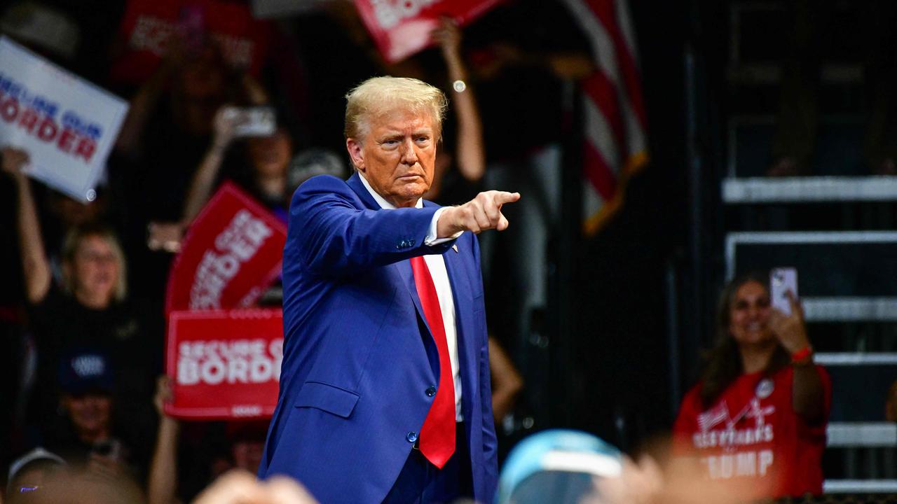 Former US President and Republican presidential candidate Donald Trump gestures at the crowd during a campaign rally at Findlay Toyota Arena in Prescott Valley, Arizona, on October 13, 2024. (Photo by Caitlin O'Hara / AFP)