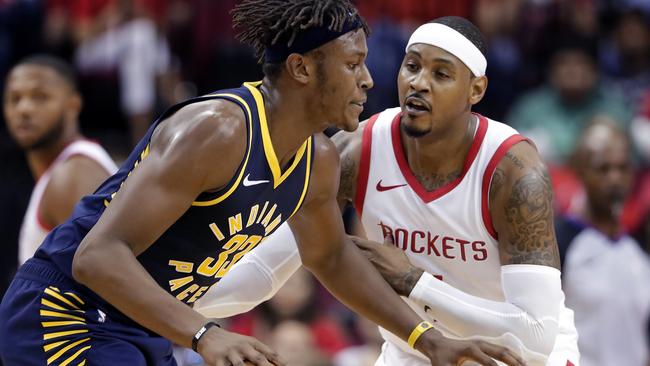 Myles Turner tries to drive around Carmelo Anthony.