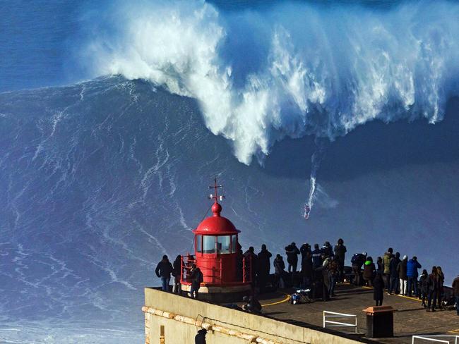 Waves at Nazare are a result of storms and an underwater canyon. Clarke-Jones surfing bombs at Nazare in January.