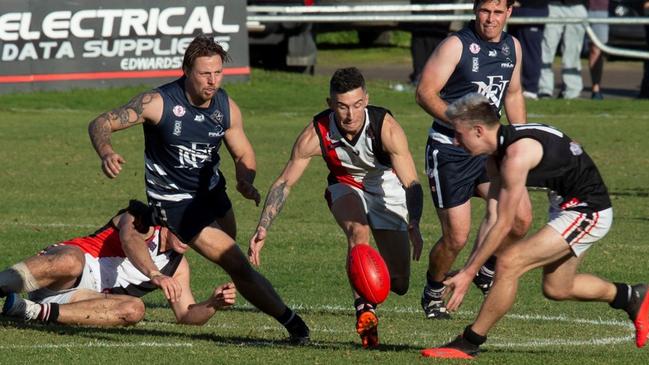 Action from the Christies Beach v Noarlunga SFL round one clash. The Saints won by a point after being six goals down. Picture: James Baker Photography