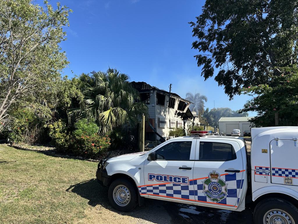 Police set up a crime scene at Barnacles Backpackers in Bowen after a fire engulfed the building, April 30, 2025