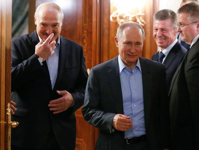 Russian President Vladimir Putin (C) and Belarusian President Alexander Lukashenko (L) walking during their meeting in the Black sea resort of Sochi. Belarusian President Alexander Lukashenko discussed the protests shaking his country with Russian counterpart. Picture: AFP