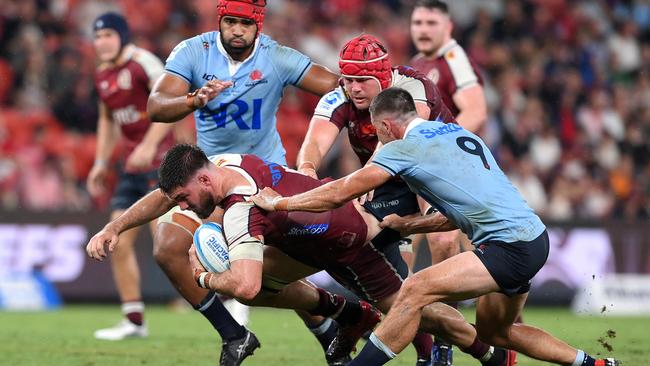 Liam Wright tries to charge his way through the NSW defence in Queensland’s 40-22 win over the Waratahs. Picture: Bradley Kanaris/Getty Images