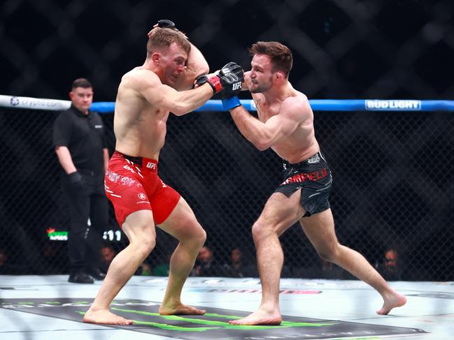 Canada’s Brad Katona trades punches with Garrett Armfield. Picture: Vaughn Ridley/Getty Images/AFP