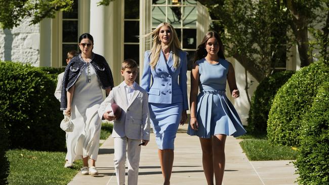 Ivank and two of her children walk towards the South Lawn. (AP Photo/Mark Schiefelbein)