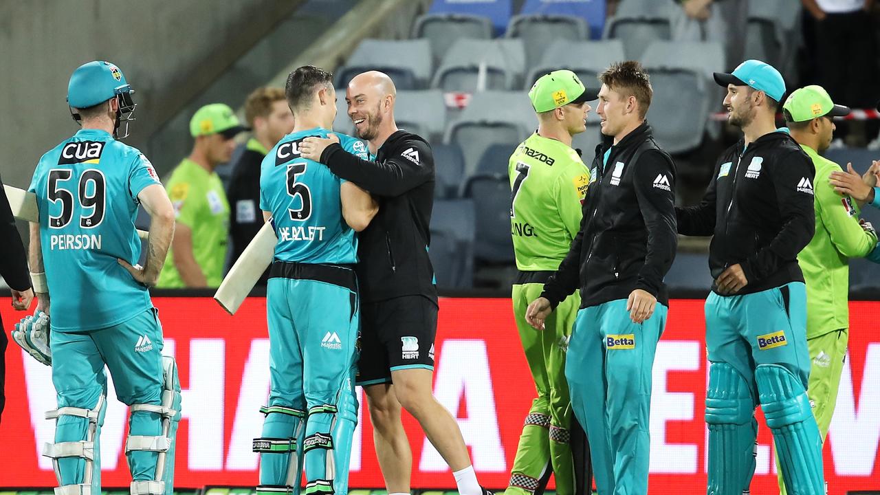 Sam Heazlett (second from left) is congratulate by his Brisbane Heat captain Chris Lynn. Picture: Mark Kolbe/Getty Images