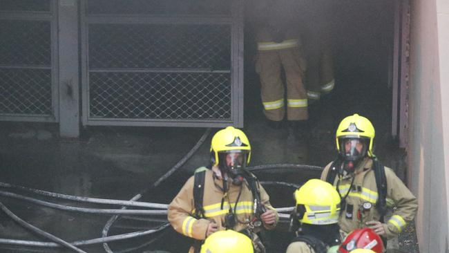 Firefighters had to wear breathing apparatus to attack the seat of the fire in the basement car park. Picture: News Corp