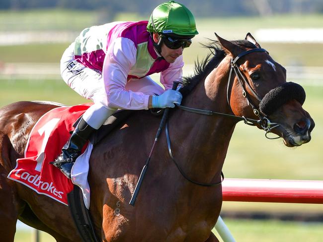 MELBOURNE, AUSTRALIA - JULY 20: Ben Melham riding Delicious Tycoon winning Race 3, the Ladbrokes Easy Form Handicap during Melbourne Racing at Sandown Hillside  on July 20, 2022 in Melbourne, Australia. (Photo by Vince Caligiuri/Getty Images)