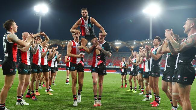 St Kilda’s Paddy Ryder is chaired from the field after his 250th match after the Saints defeated Gold Coast at Metricon Stadium. Picture: Getty Images