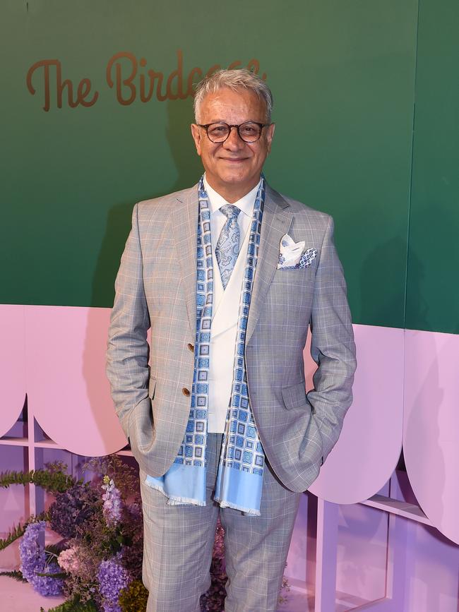 Fashion designer Dom Bagnato sported a grey checked suit, with a blue scarf and tie accenting the look. Picture: NCA NewsWire / Josie Hayden