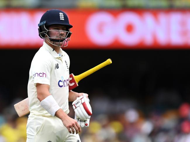 BRISBANE, AUSTRALIA - DECEMBER 10: Rory Burns of England looks dejected after being dismissed by Pat Cummins of Australia during day three of the First Test Match in the Ashes series between Australia and England at The Gabba on December 10, 2021 in Brisbane, Australia. (Photo by Bradley Kanaris/Getty Images)