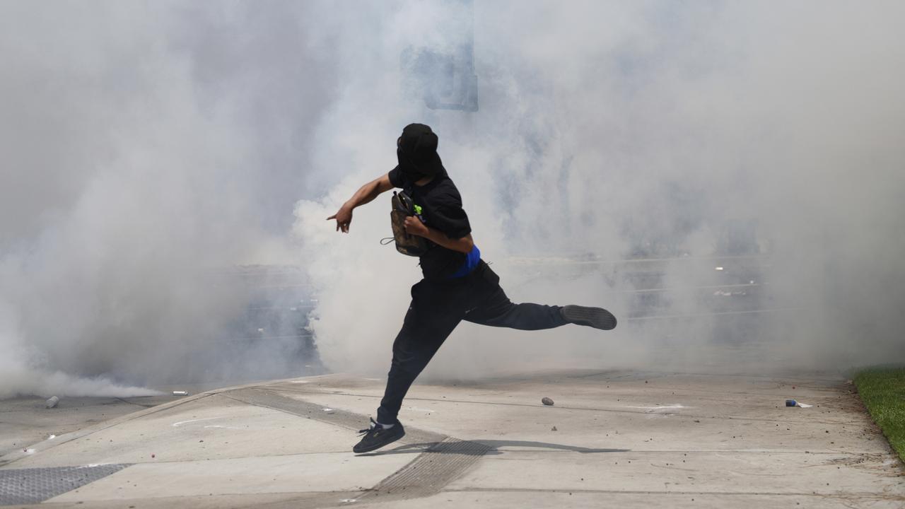 Tear gas, smoke and arrests as LA immigration protests turn violent
